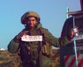 Israeli-soldier-holding-nanach-sticker.jpg